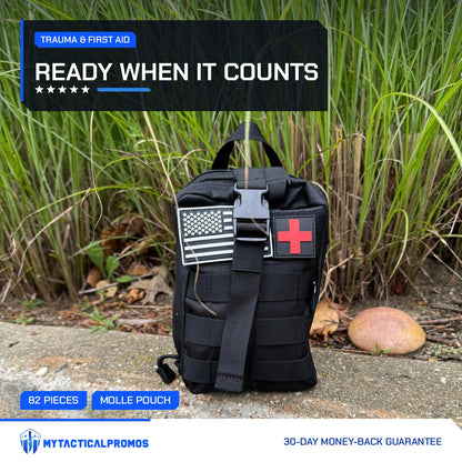 Trauma First Aid Kit MOLLE pouch with US flag and red cross patches outdoors by tall grass