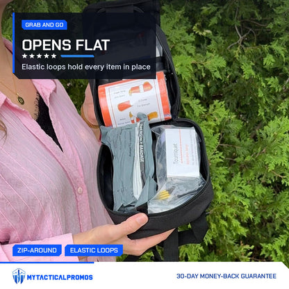 Trauma First Aid Kit unzipped flat with trauma bandage and tourniquet held in elastic loops