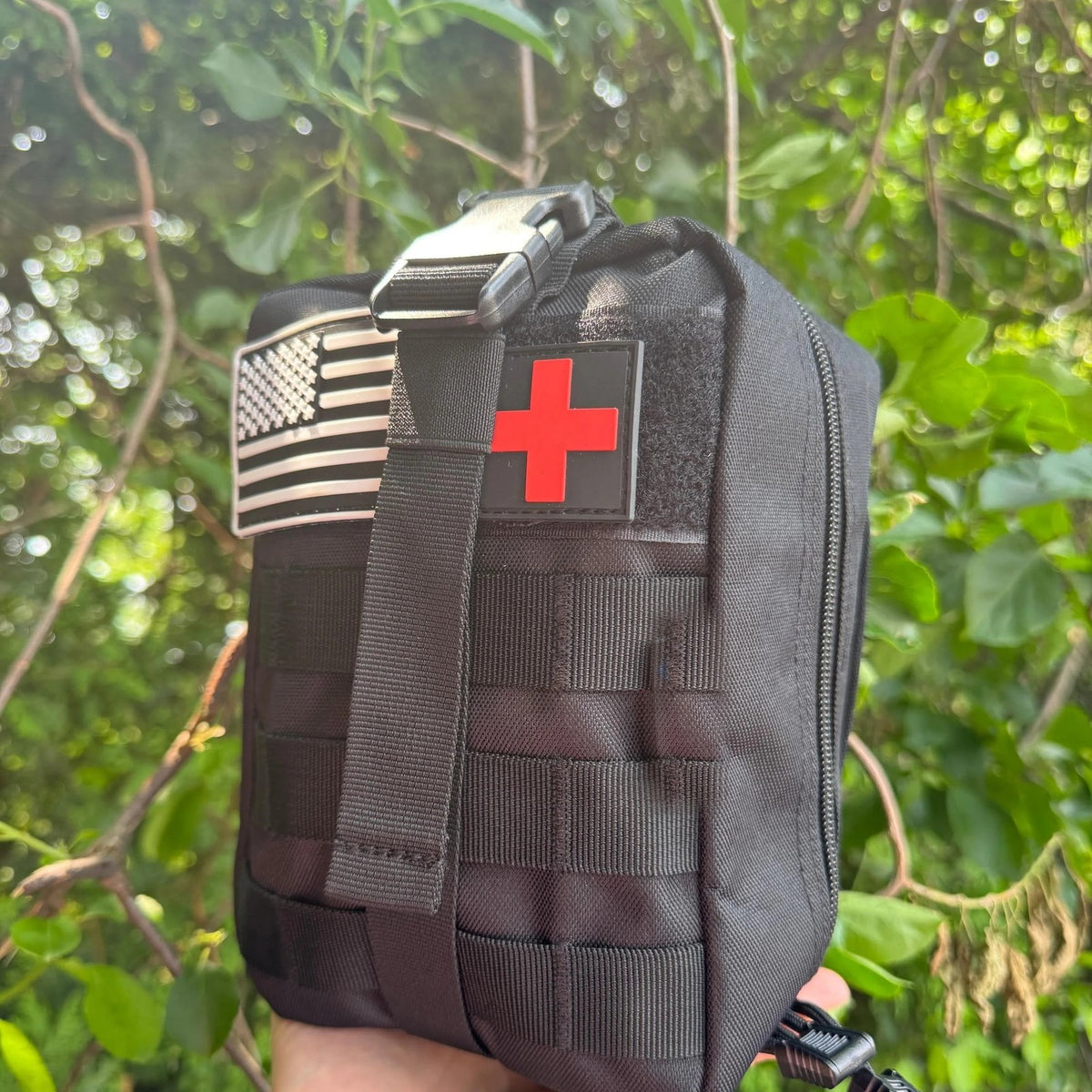 Trauma First Aid Kit side angle showing the buckle strap and zip-around pouch