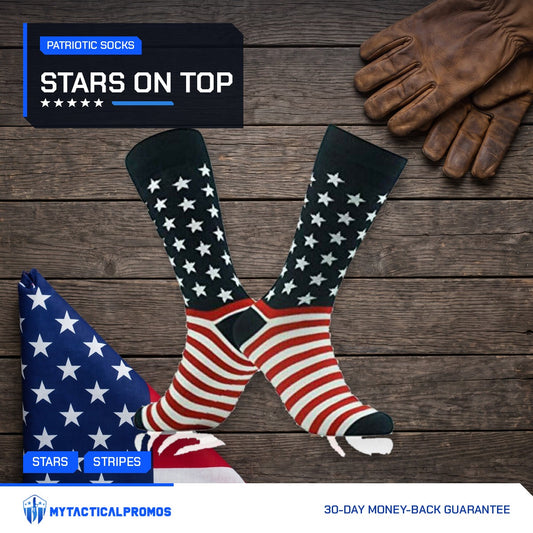 American Flag Socks pair on a dark wood table with work gloves and a folded flag