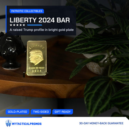 Trump Liberty 2024 gold-plated bar on a stand on a wooden shelf beside a plant