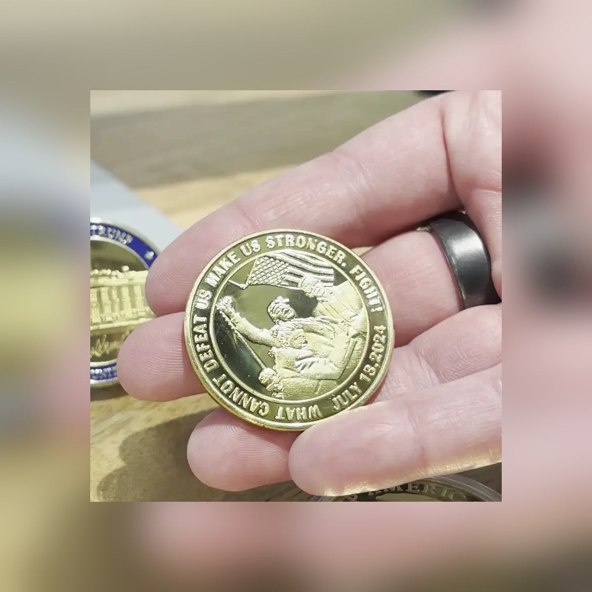 Trump July 13 Coin V2 engraved side held in hand: What Cannot Defeat Us Makes Us Stronger. Fight!