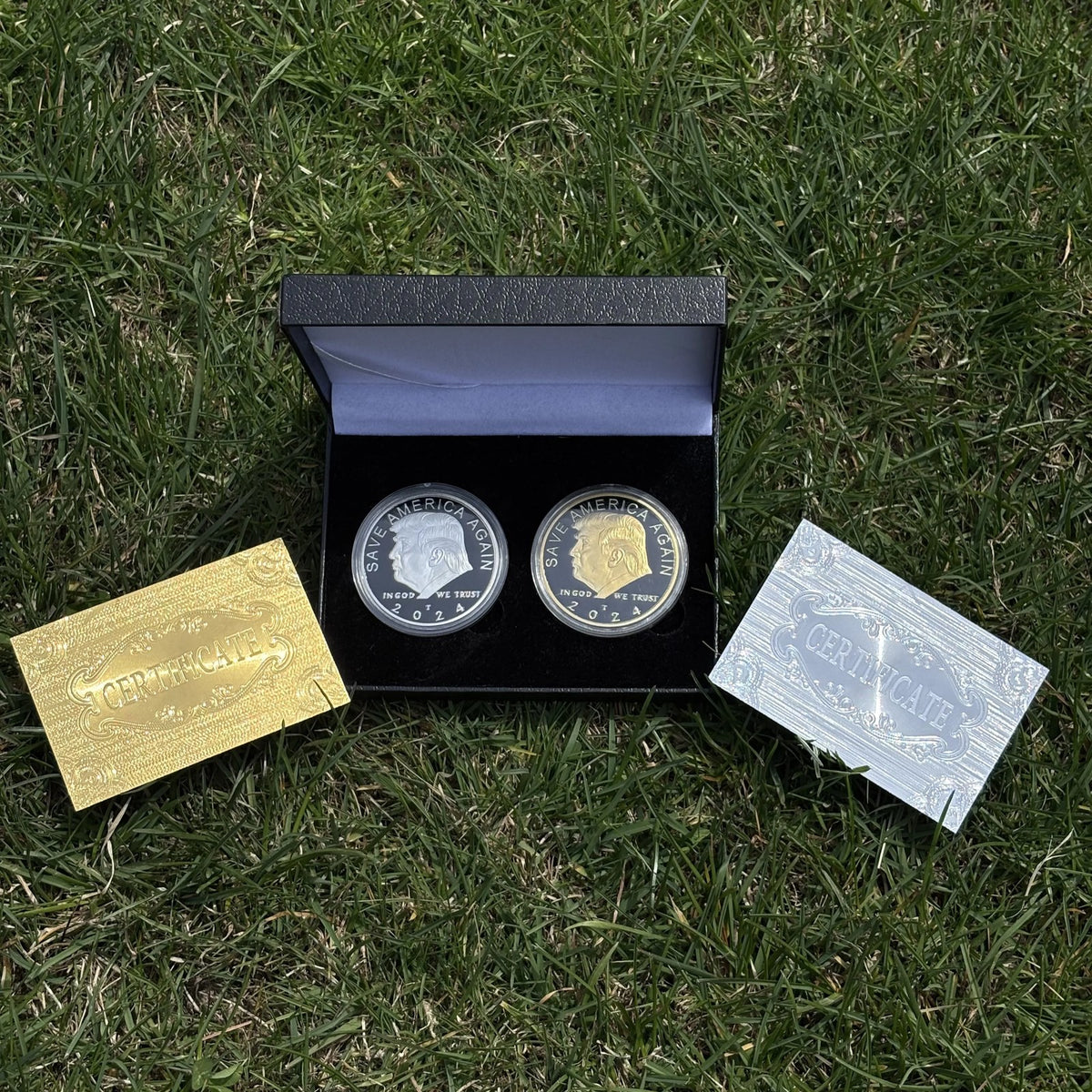 Trump gold and silver coin case open on grass with gold and silver certificate cards