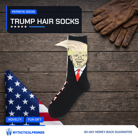 Trump Hair Socks on a dark wood table with a folded flag and work gloves