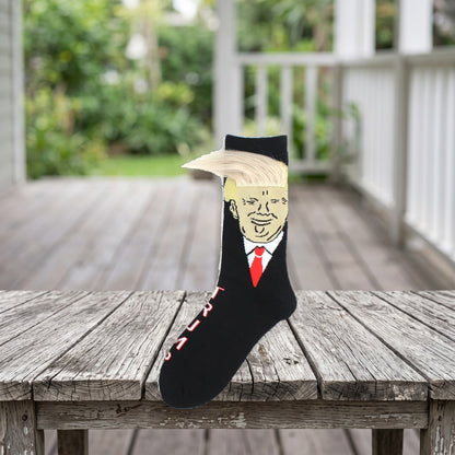 Trump Hair Socks standing on a weathered porch table