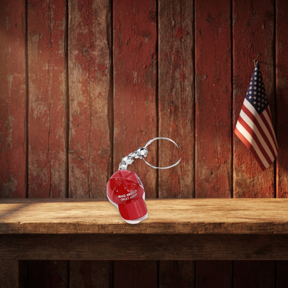 Trump MAGA Hat Keychain on a rustic barn shelf with a small flag