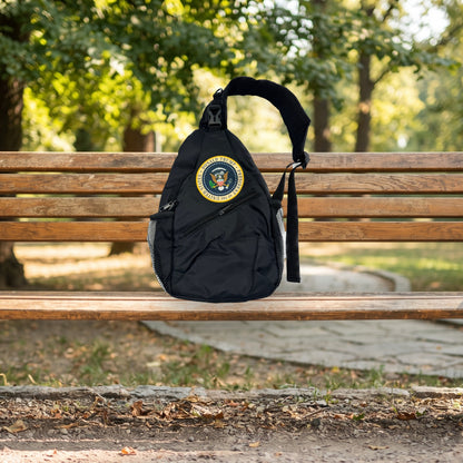 Trump Seal Sling Bag on a wooden park bench