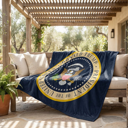 Trump Presidential Blanket draped over an outdoor patio sofa