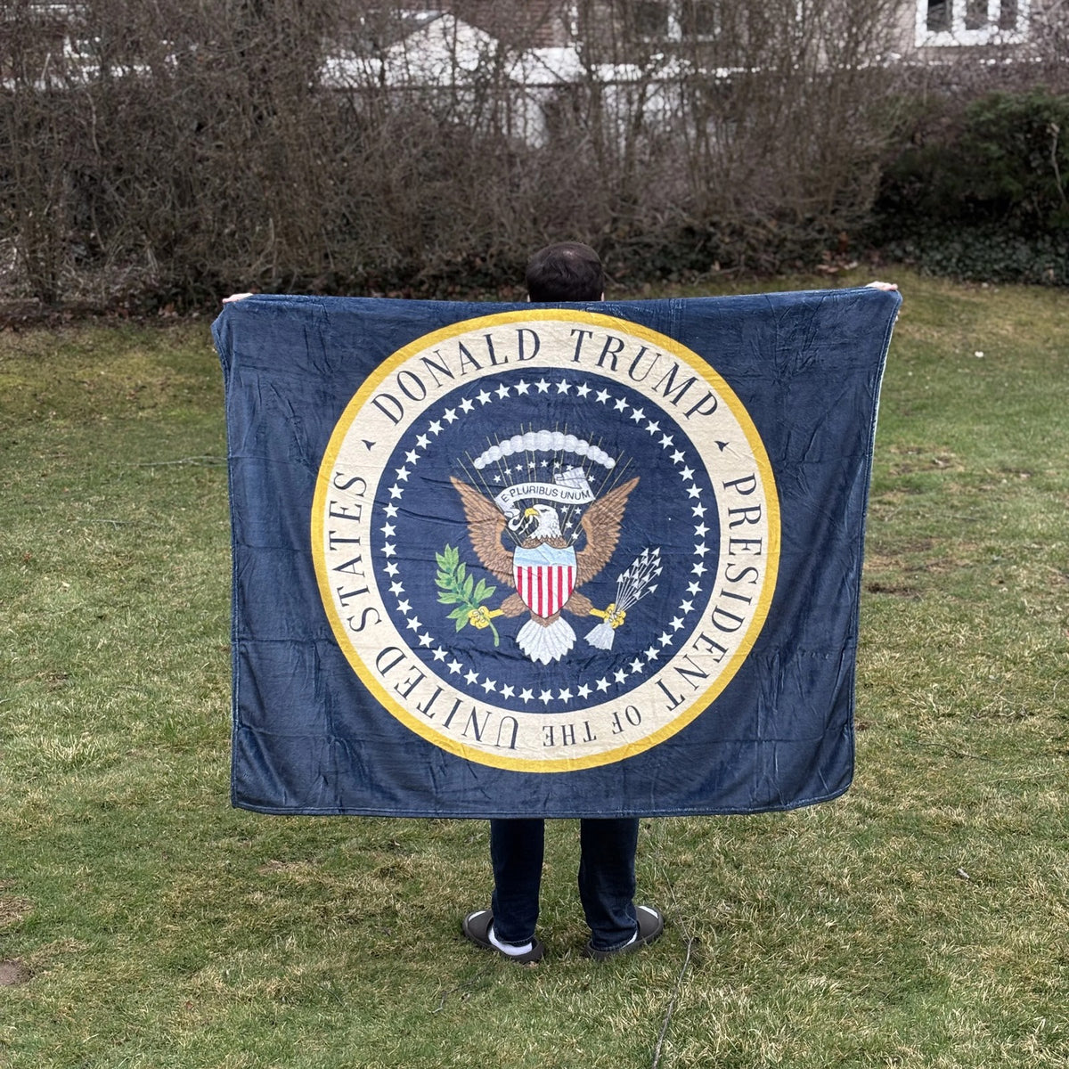 Trump Presidential Blanket held open in a backyard to show its size