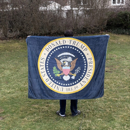 Trump Presidential Blanket held open in a backyard to show its size