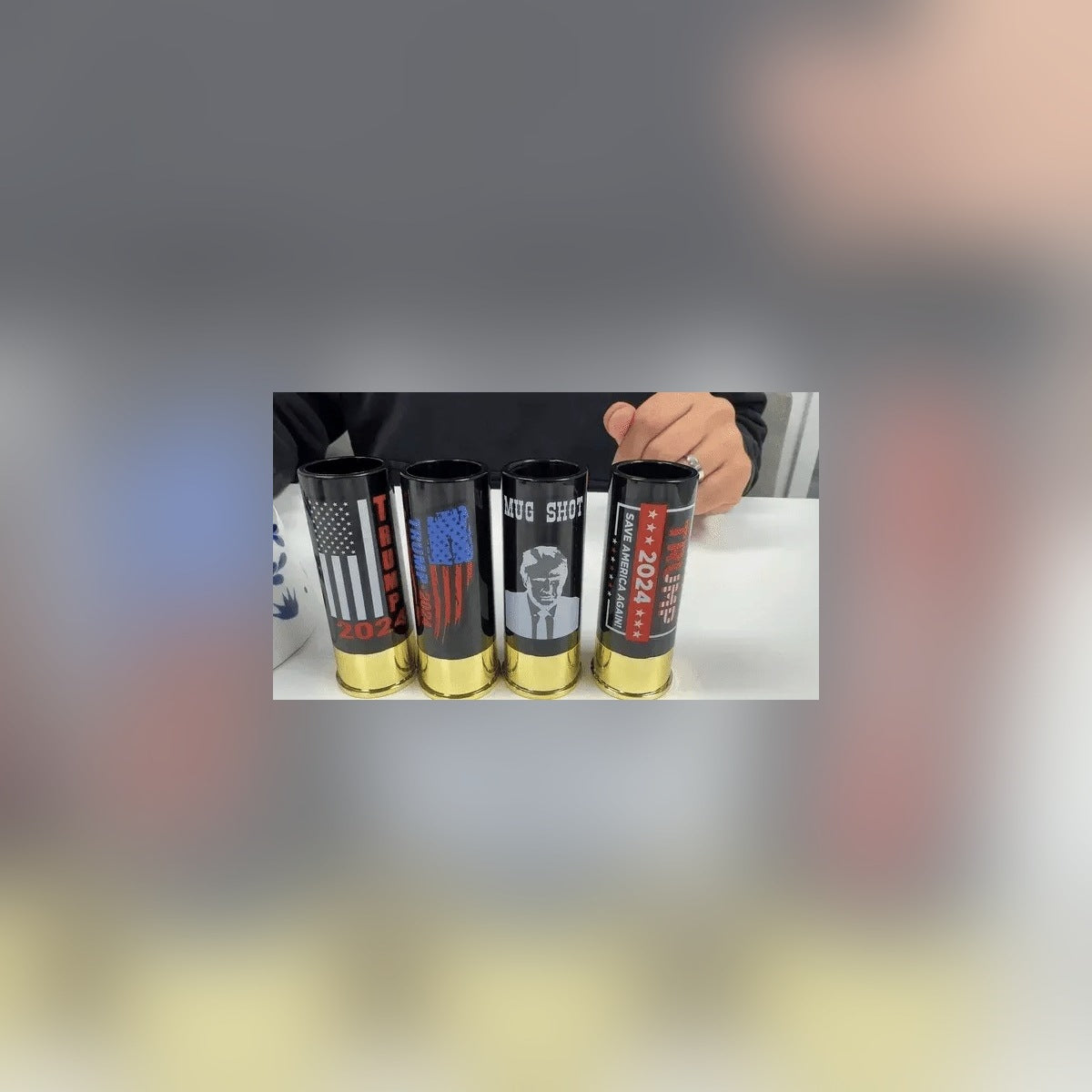 Trump Shot Glass Set of 4 lined up on a table, real photo