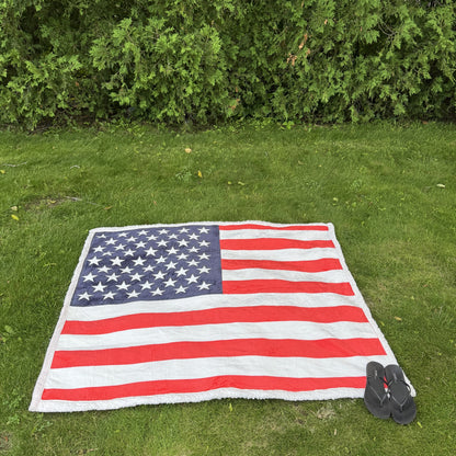 USA Flag Throw Blanket spread flat on the lawn, seen from above