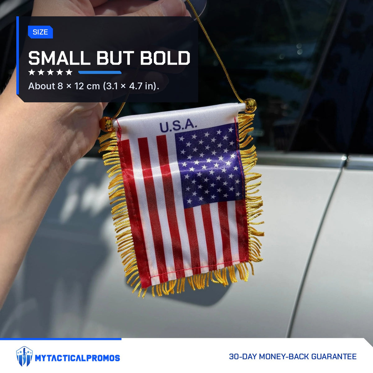 USA Flag Mini Pennant held by its cord next to a car