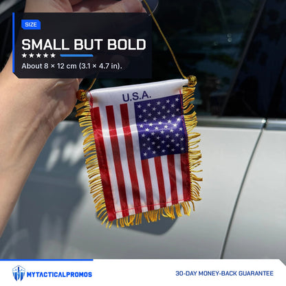 USA Flag Mini Pennant held by its cord next to a car