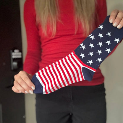 Woman holding up one of the USA Flag Socks