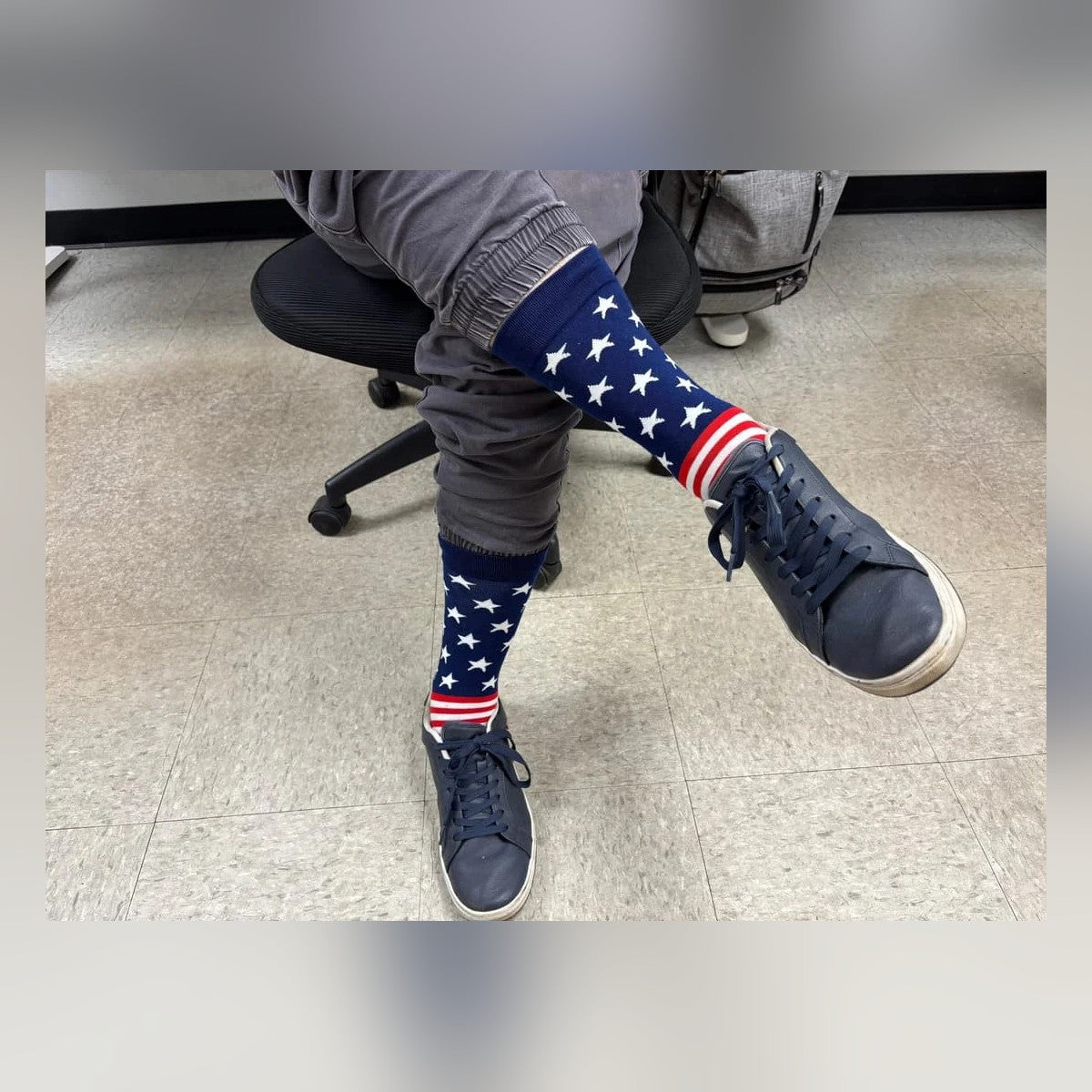 USA Flag Socks worn with sneakers in an office