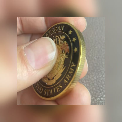Army Veteran Tribute Coin held between two fingers to show its size