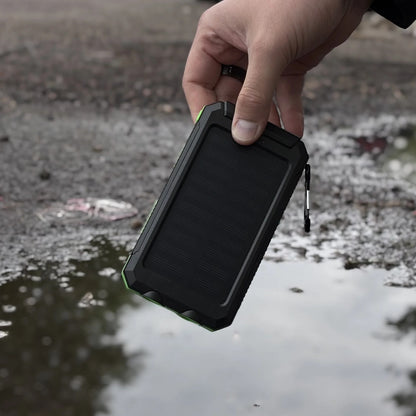 Waterproof Solar Charger held over a rain puddle